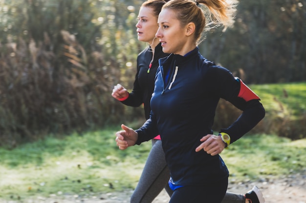 Fit girls running in the park