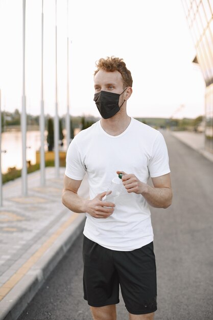 Fit man jogging outdoors