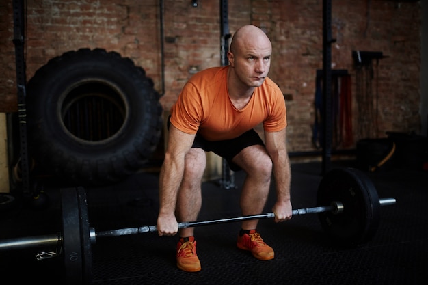 Fit Man Lifting Barbell