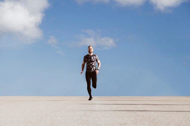 Fit man running on street