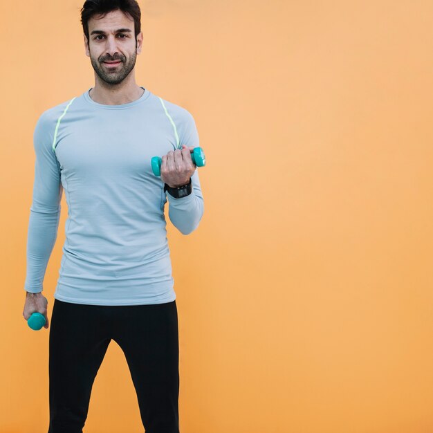 Fit man with dumbbells