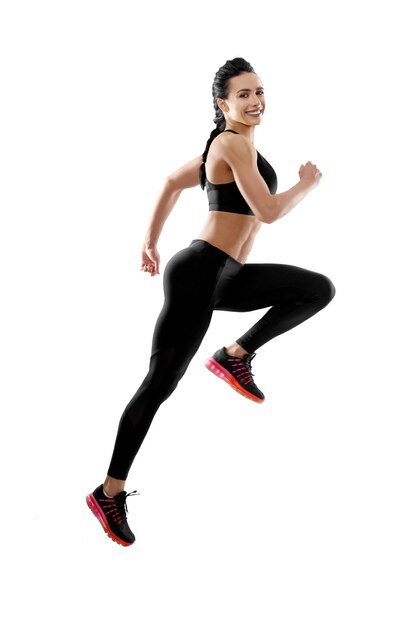 Fit model running on white studio background