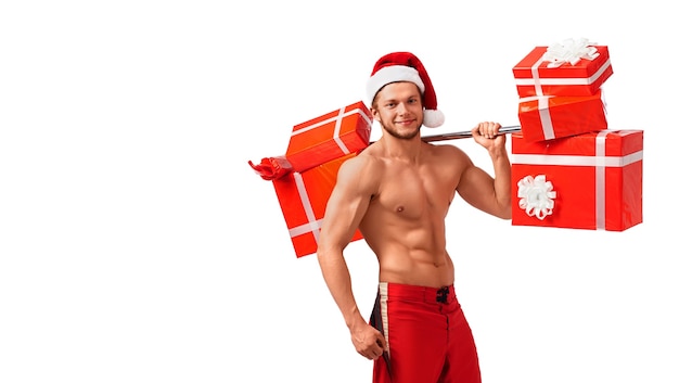 Fit naked santa claus with a barbell full of presents