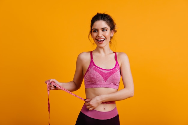 Free photo fit woman in good mood enjoying diet