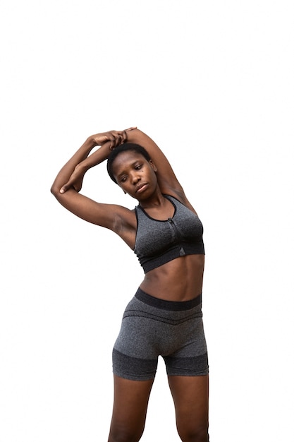 Fit woman stretching medium shot