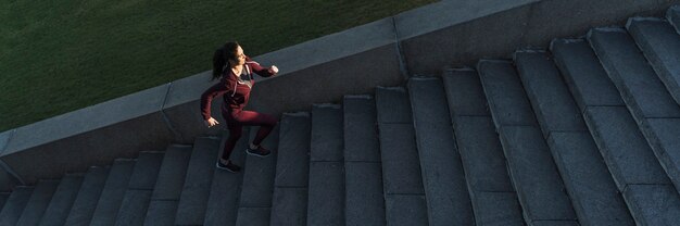 Fit young woman climbing stairs