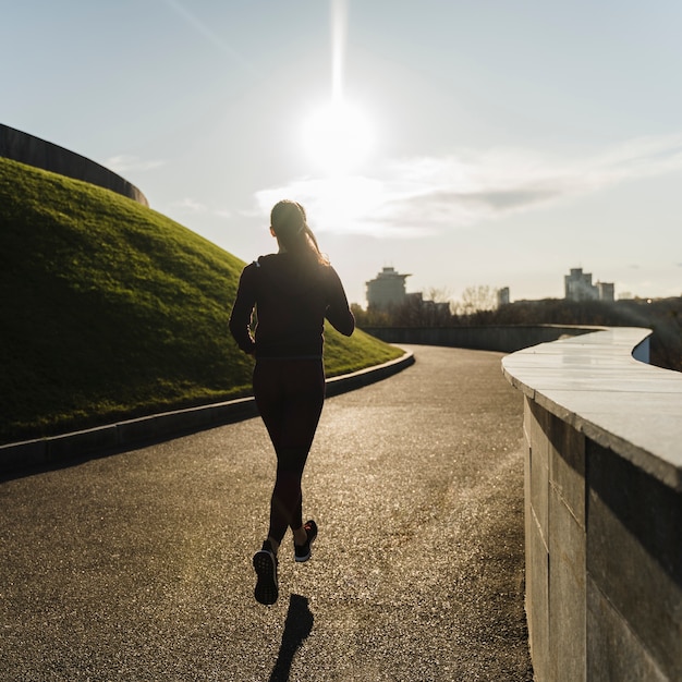 Fit young woman running in the park