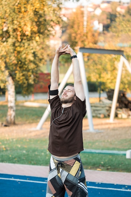 Free photo fitness boy stretching