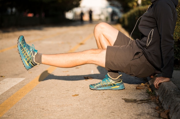 Free photo fitness boy stretching