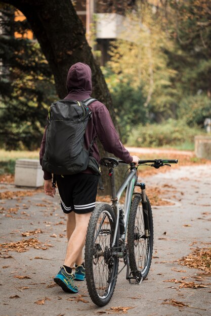 Fitness boy with bike at park