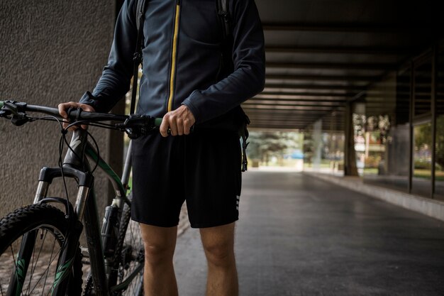 Fitness boy with bike