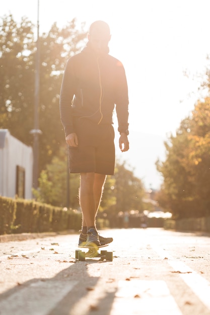 Fitness boy with skateboard