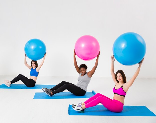 Fitness class exercise with balls