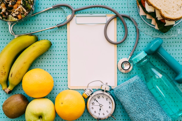 Fitness concept with stethoscope and clipboard