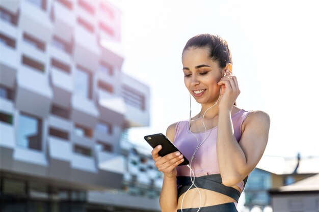 Fitness girl listening to a music