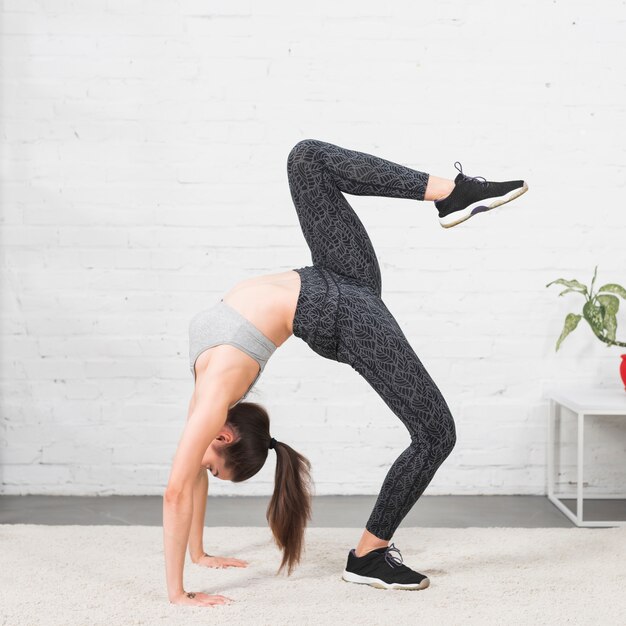 Fitness girl practising yoga