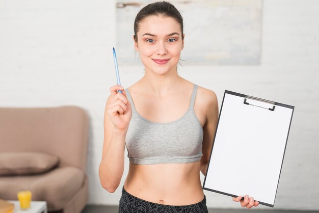 Fitness girl showing folder