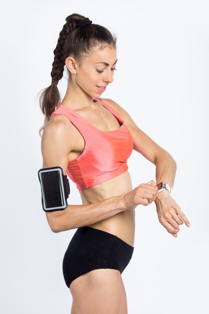 Fitness girl with smartwatch