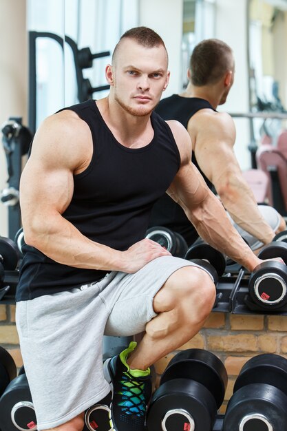 Fitness. Handsome man in the gym