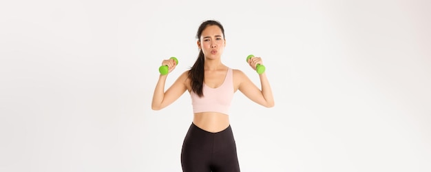 Fitness healthy lifestyle and wellbeing concept portrait of tired asian girl in sportswear looking e