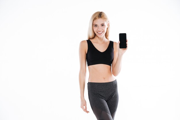 Fitness lady showing mobile phone display