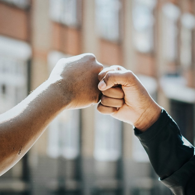 Free photo fitness partners doing a fist bump