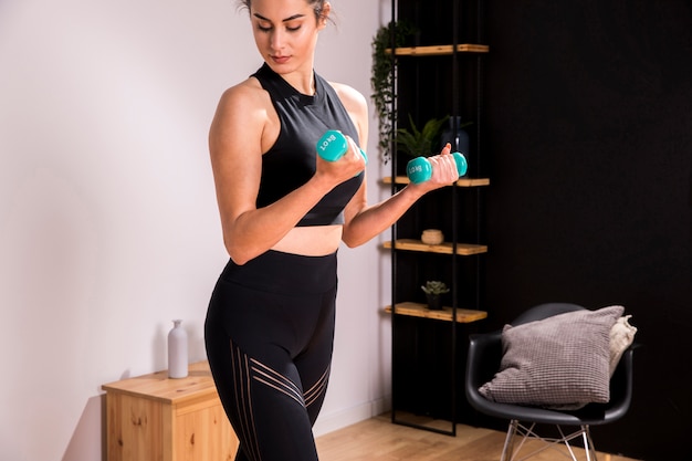 Fitness woman doing exercise at home