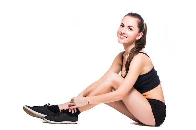 Fitness woman doing stretching exercise isolated on white background