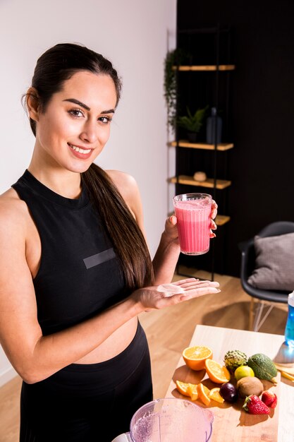 fitness woman drinking a detox juice