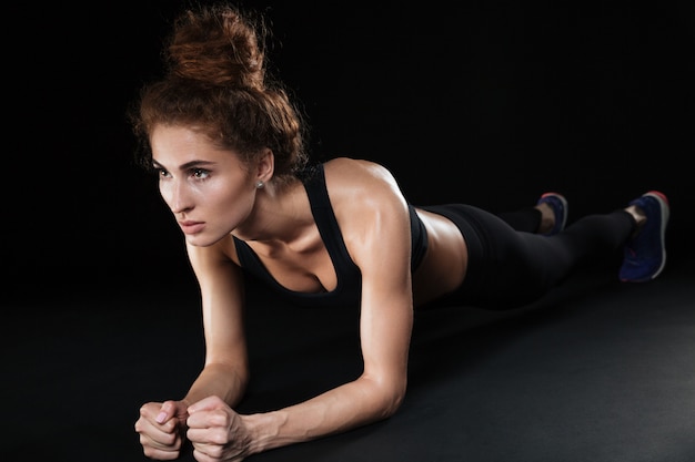 Fitness woman make plank exercise