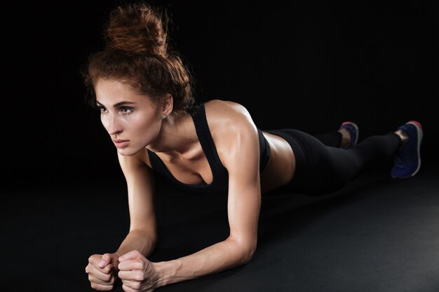 Fitness woman make plank exercise