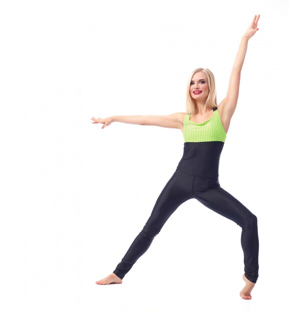 fitness woman posing gracefully on white