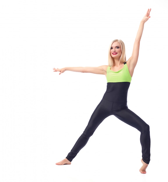 fitness woman posing gracefully on white