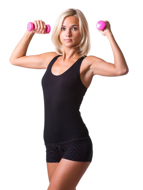 Fitness woman working out with dumbbell isolated on white background