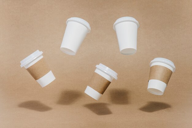 Five coffee cups in air