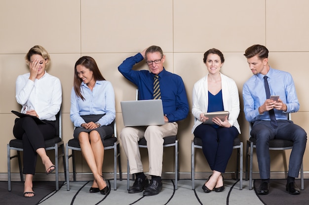 Five Content Applicants Sitting in Waiting Room