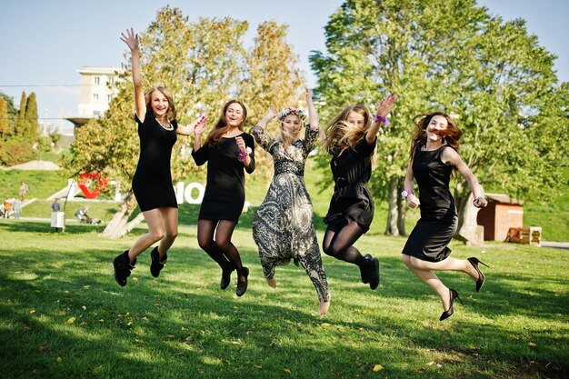 Five girls wear on black jumping at hen party