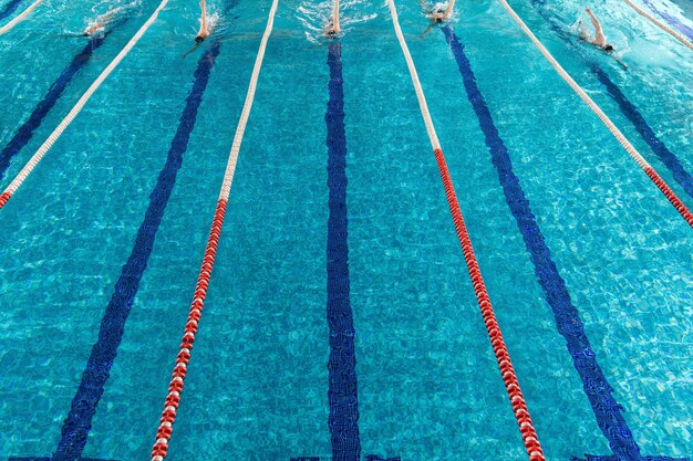 Five male swimmers racing against each other