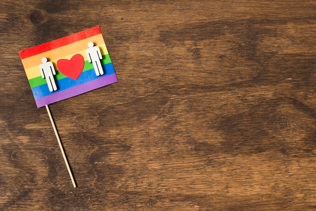 Flag in rainbow colors with gay couple