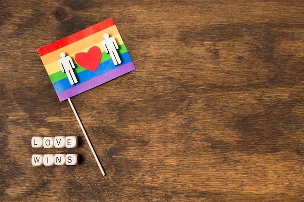 Flag in rainbow colors with gay couple