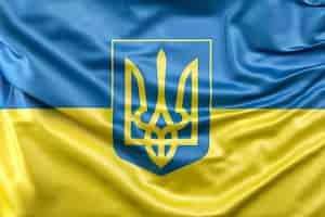 Free photo flag of ukraine with coat of arms