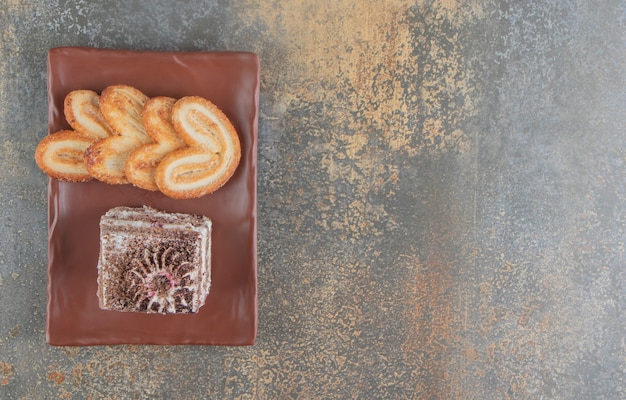 Flaky cookies and a slice of cake 