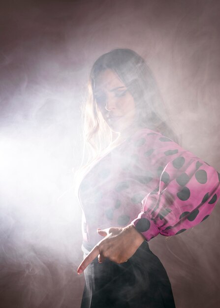 Flamenca dancer covered in smoke