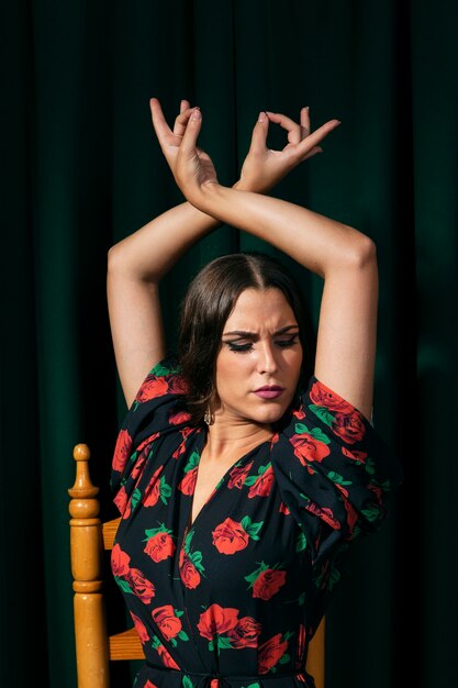 Flamenca dancer raising hands up