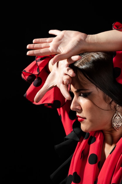 Flamenca performing floreo looking down