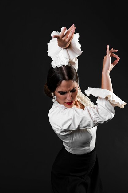 Flamenca with arms up looking down