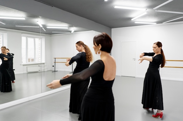 Free photo flamenco dancers in studio