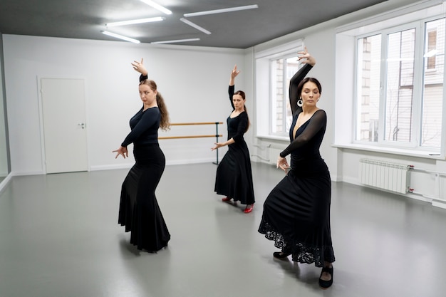 Free photo flamenco dancers in studio