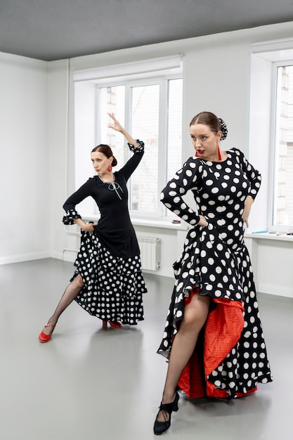 Free photo flamenco dancers in studio