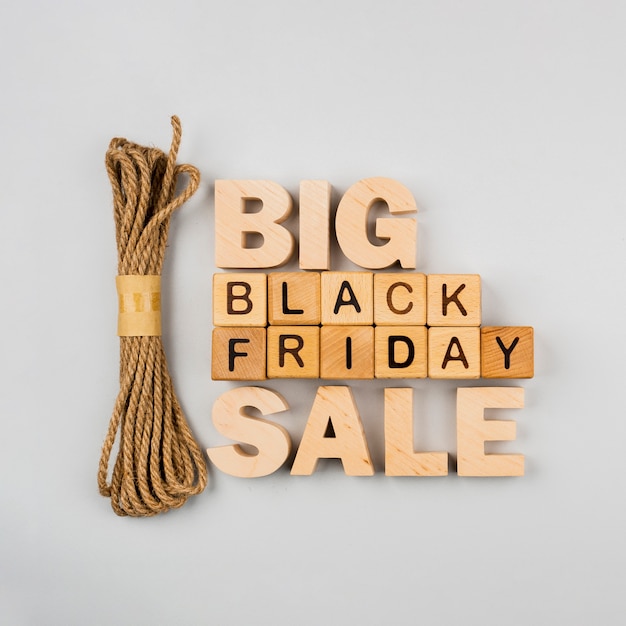 Flar lay of black friday cubes and rope on plain background